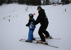 Daniel Wallhead having a ski lesson